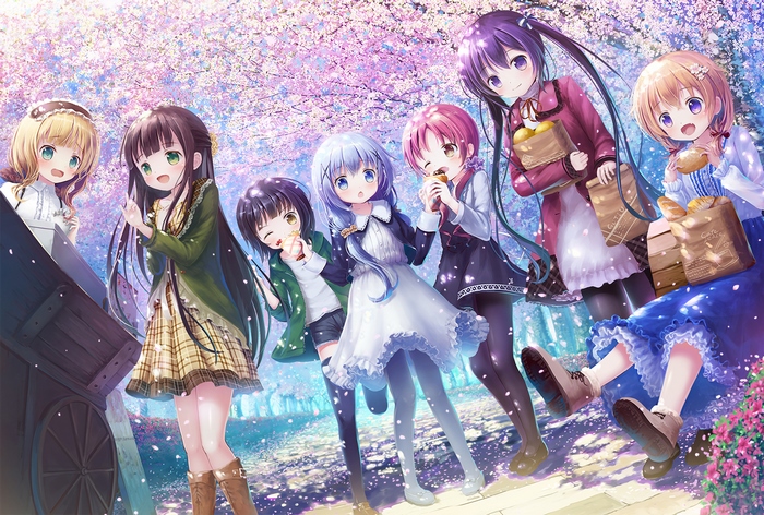 Girls enjoying picnic under cherry blossoms