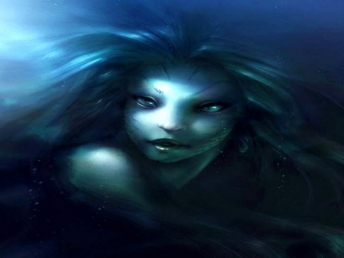 Mermaid in dark blue water
