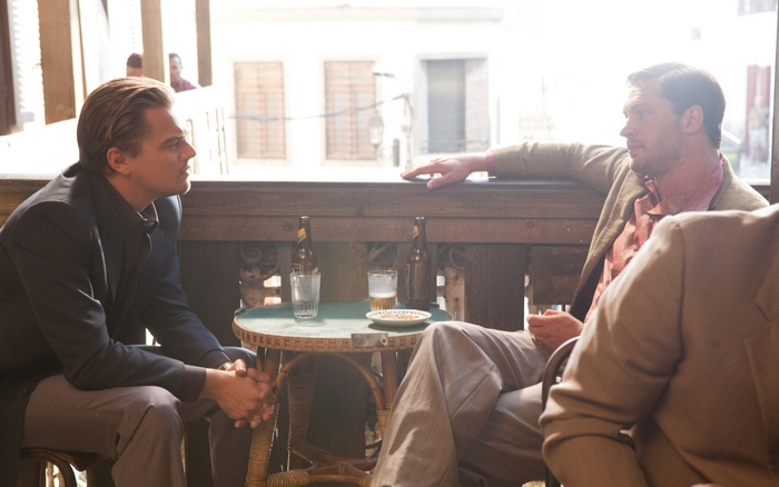 Tom Hardy and Leonardo DiCaprio at a table
