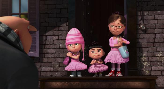 Three girls in pink dresses and Gru from Despicable Me
