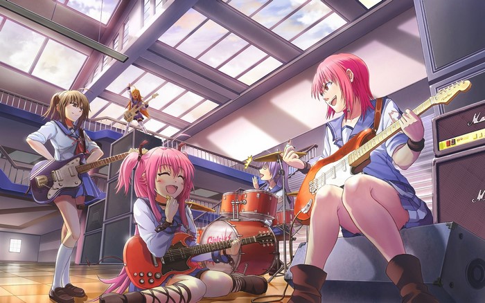 Yui and bandmates playing guitars in a room
