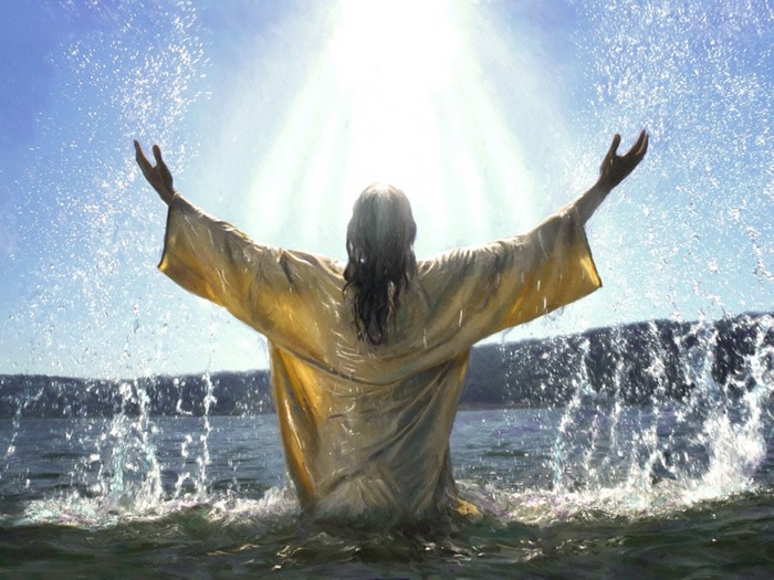 Jesus in water with arms raised
