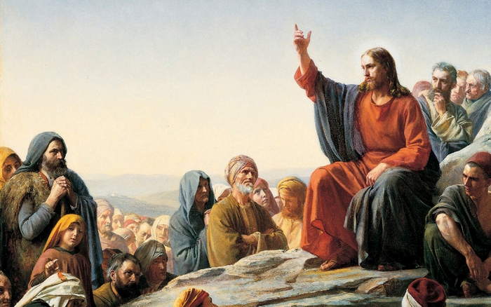 Jesus preaching to a crowd on a hill