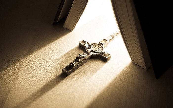 Crucifix between two books