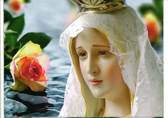 Statue of Mary with a rose and crown