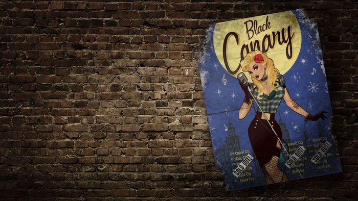 Black Canary poster on brick wall