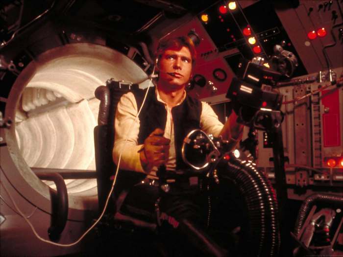 Han Solo from Star Wars in the Millennium Falcon cockpit