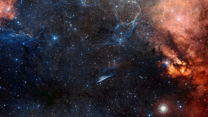 Starry night sky with nebulae and galaxies