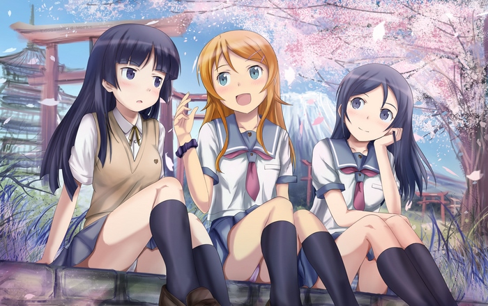 Three schoolgirls under cherry blossoms