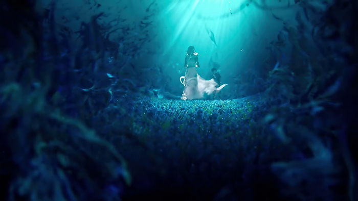 Woman in white dress in underwater cave