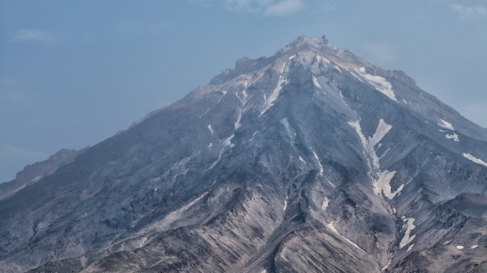 Volcano peak with snow and blue sky