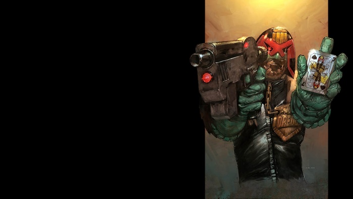 Judge Dredd holding a gun and a playing card