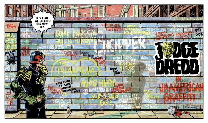 Judge Dredd standing in front of graffiti wall