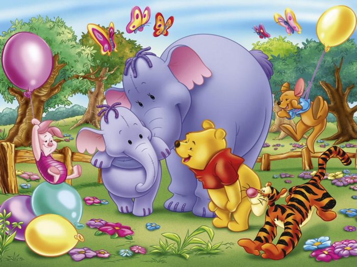 Winnie the Pooh characters in a park with balloons