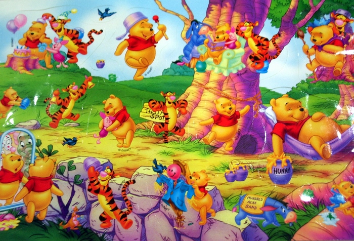 Winnie the Pooh characters celebrating outdoors