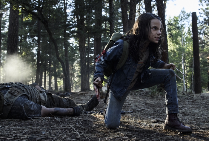 X-23 in a forest with a fallen soldier
