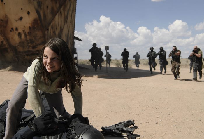 X-23 fighting soldiers in a desert