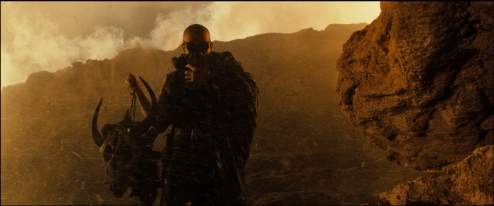 Riddick holding a skull