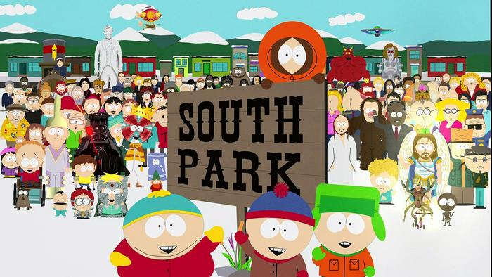 South Park characters in front of the town sign