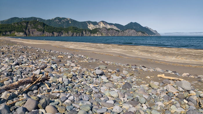 Rocky beach with mountains and ocean