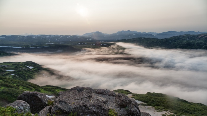 Foggy mountain valley at sunrise