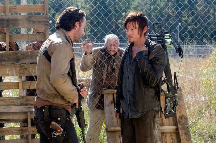 Rick Grimes and Daryl Dixon with a walker
