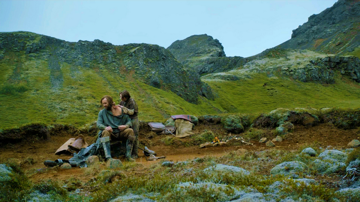 Sandor Clegane and Arya Stark in a mountainous landscape