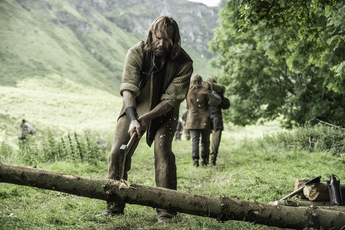 Sandor Clegane from Game of Thrones chopping wood