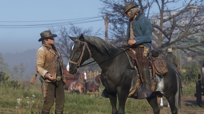 Arthur Morgan and man on horseback in Red Dead Redemption 2