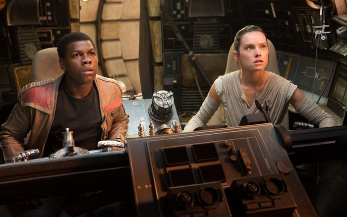 Finn and Rey from Star Wars in the Millennium Falcon