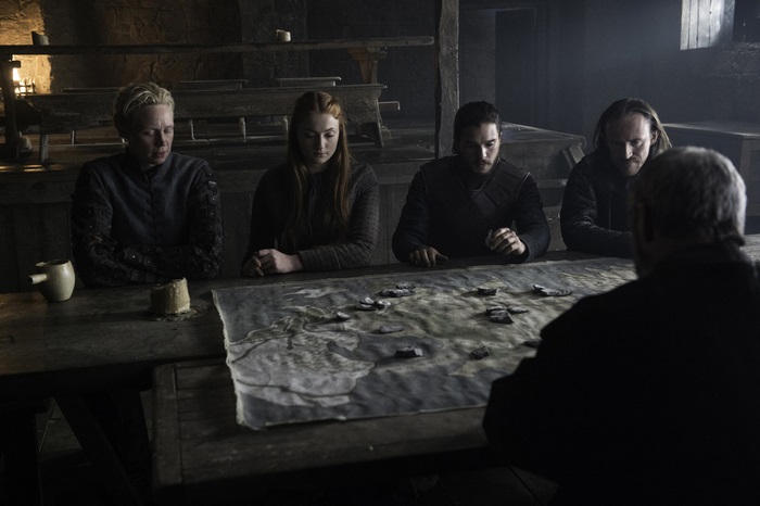 Brienne of Tarth and others at a table with a map