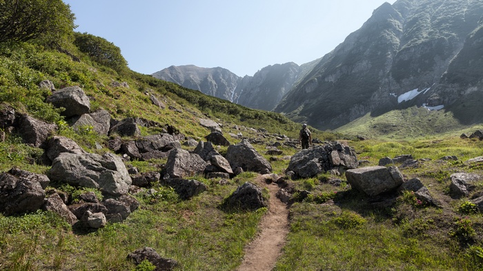 Person hiking on a rocky mountain trail