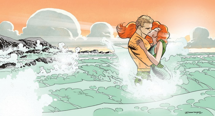 Aquaman and Mera kissing in the ocean waves