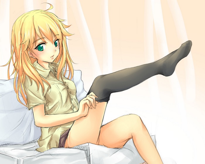 Miki Hoshii sitting on a bed