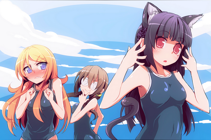 Three girls in swimsuits at the beach