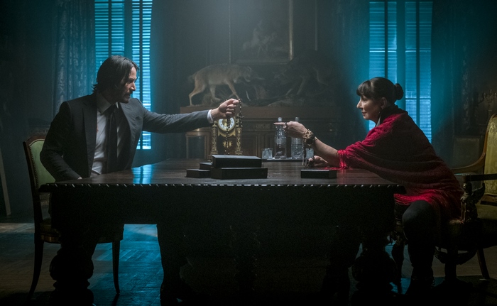 John Wick and Sofia at a table