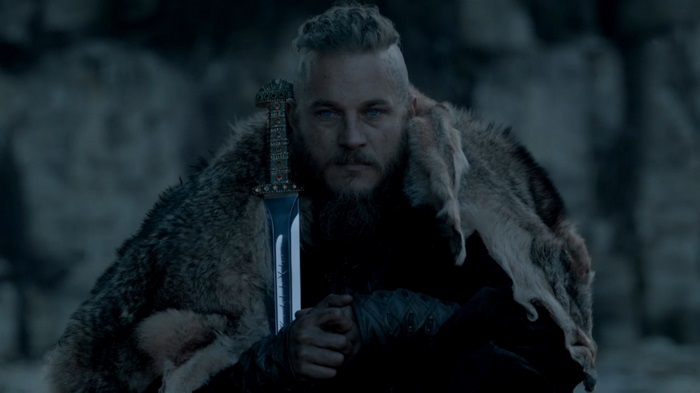 Ragnar Lothbrok Holding Sword in Fur Cloak