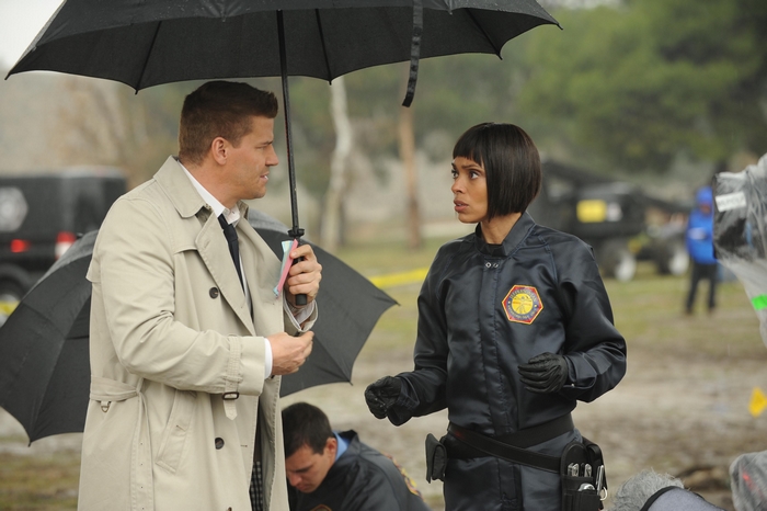 Seeley Booth and a woman under an umbrella