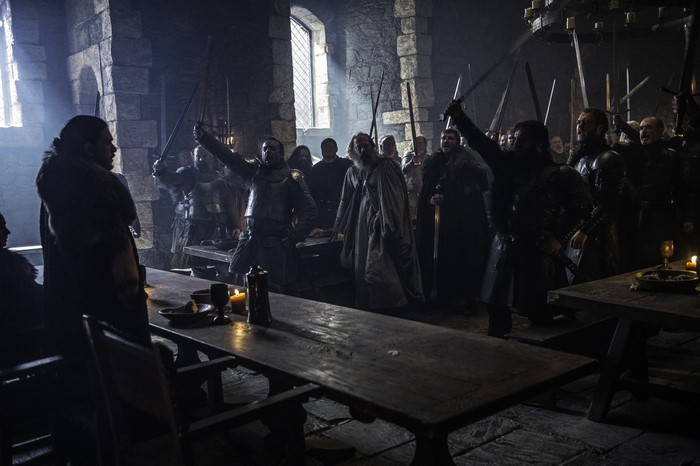 Davos Seaworth and men in a castle hall