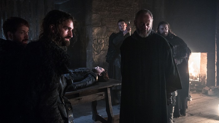 Davos Seaworth and others in a dark room