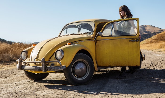Bumblebee and a young woman on a dirt road