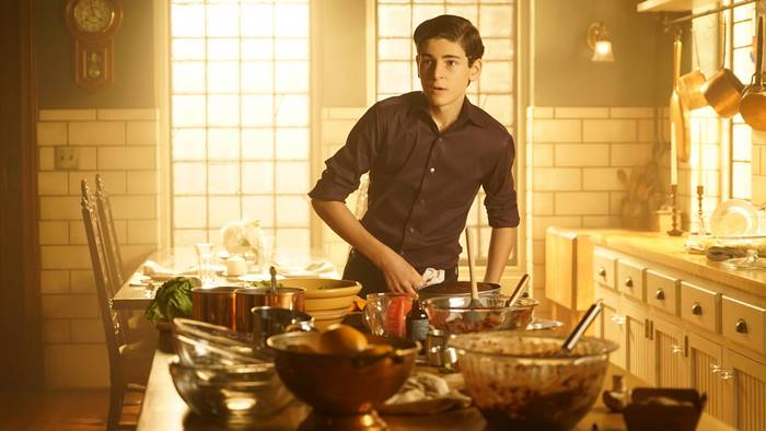 Bruce Wayne in a kitchen