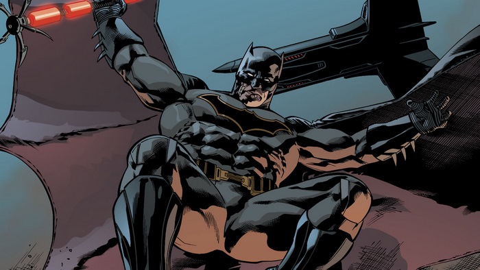 Batman holding a Batarang