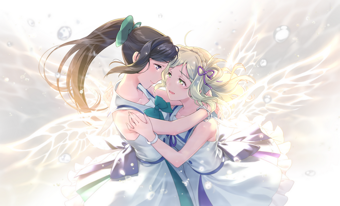 Two girls embracing with angelic wings