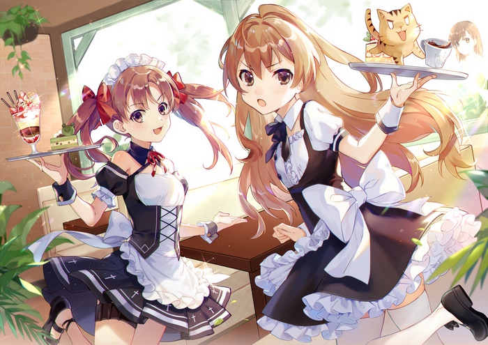 Two maids serving desserts in a cafe