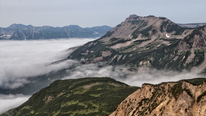 Mountain peaks shrouded in fog