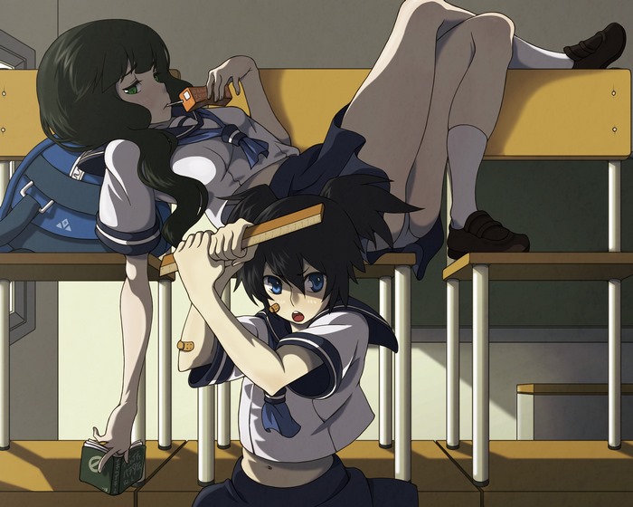 Two girls in school uniforms on a desk