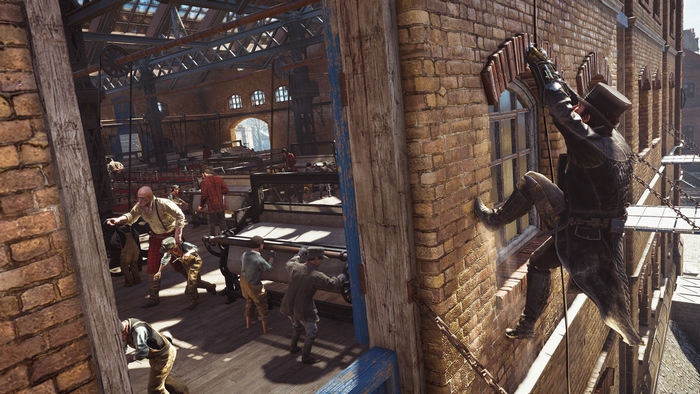 Jacob Frye climbing a brick wall in a factory