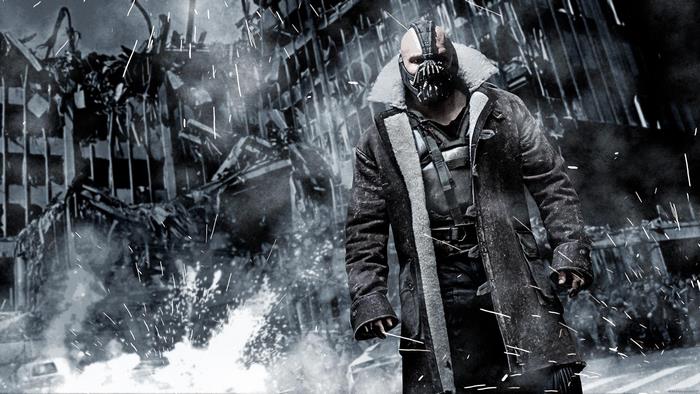 Bane from Batman in front of a destroyed building