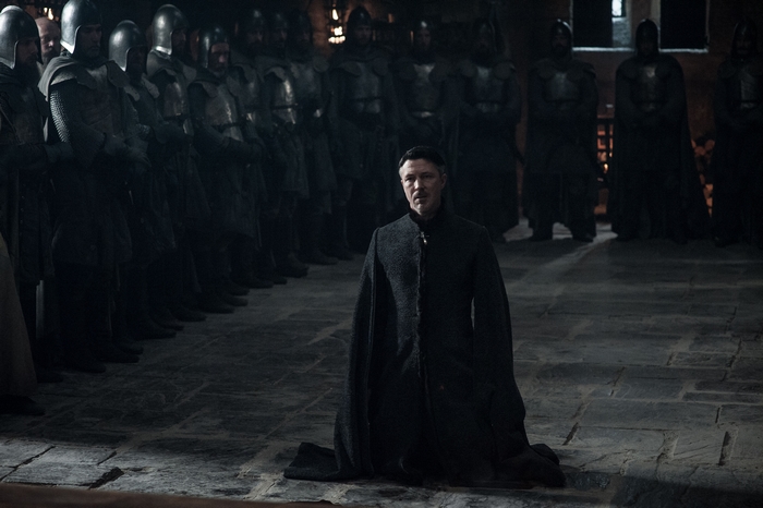 Petyr Baelish kneeling before soldiers